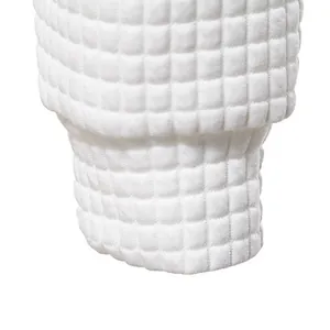 Close-up detail showing the white square jacquard texture of the men's sweatshirt