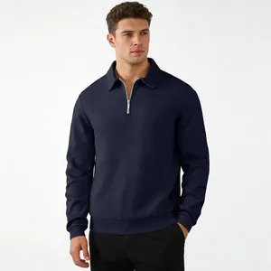 Detailed view of a men's navy blue textured quarter-zip sweatshirt with a polo collar.