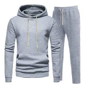 Detailed view of light blue men's jacquard tracksuit set featuring textured hoodie and joggers
