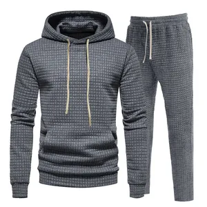 Detailed view of the grey waffle knit texture on this men's casual tracksuit set.