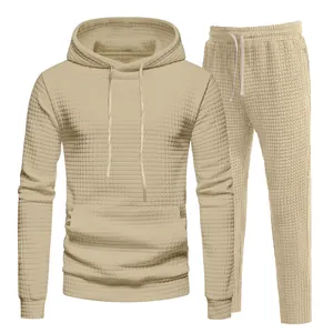 Detailed macro view of men's beige grid textured hoodie and matching sweatpants set