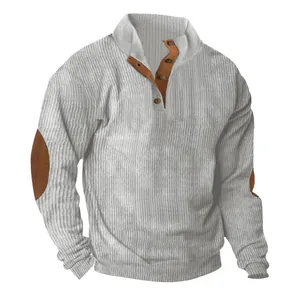 Close-up of men's ribbed corduroy sweatshirt with stand collar and elbow patches.