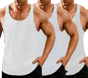Close-up of white men's athletic training tank tops featuring muscle fit and Y-back