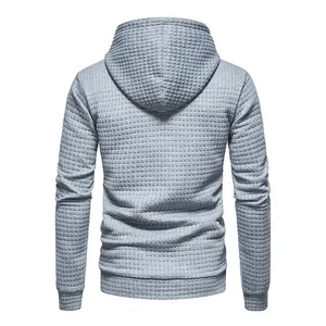 Detailed back view of gray men's hoodie featuring a unique waffle jacquard texture