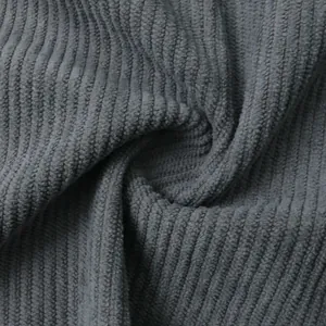 Close-up macro shot of dark gray corduroy fabric texture for men's shirt detail