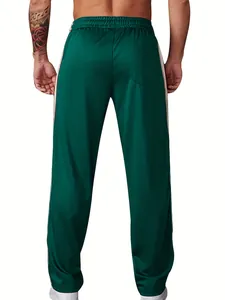 Detail rear view of men's dark green athletic sweatpants featuring white side stripes