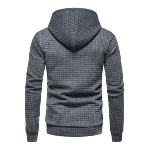 Close-up macro view of gray men's hoodie showing back details and jacquard texture