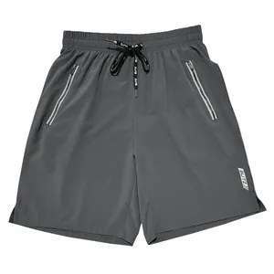 Professional front view of dark grey men's loose sports shorts with zipper pockets