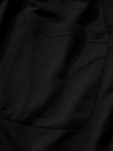 Detailed macro shot of the double-stitched pocket on these black men's casual athletic pants
