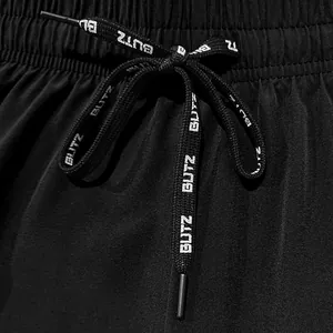 Detail view of men's casual shorts showing elastic waistband and branded drawstring