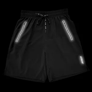 Detail view of black men's athletic shorts with high-visibility reflective zipper pockets