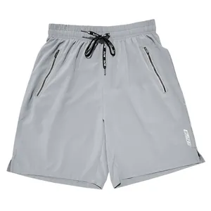 Close-up detail of grey men's relaxed sports shorts featuring drawstring and zipper pockets