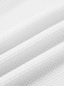 Close-up of white waffle texture fabric on a heavy cotton polo shirt for men