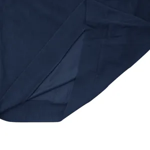 Close-up of the ribbed texture and hem stitching on a navy blue corduroy sweatshirt.