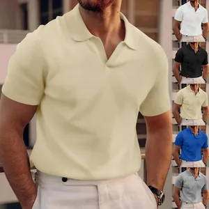 Detailed view of men's waffle knit polo shirt showing textured fabric and stylish V-neck