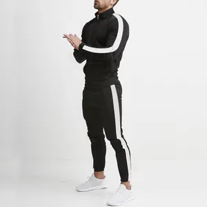 Complete side view of black men's slim fit tracksuit with white side stripe accents