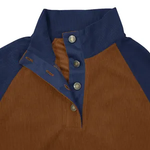 Detail view of men's corduroy sweatshirt featuring stand collar and raglan sleeves