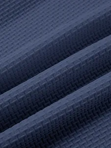 Close-up detail of navy blue waffle textured fabric for men's heavy weight Polo shirt
