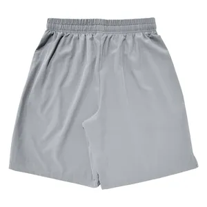 Back view detail of grey men's lightweight athletic shorts with elastic waistband
