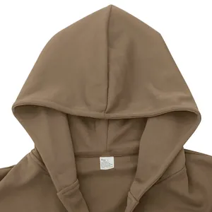 Detailed view of brown hooded jacket neckline showing size L fabric composition tag