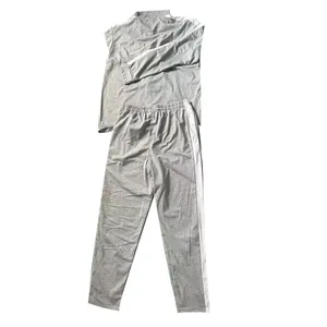 Back view of gray men's tracksuit set with white side stripes and stand collar detail
