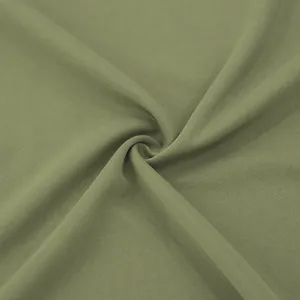 Close-up of olive green breathable fabric texture for men's hooded trench coat jacket