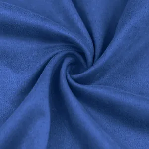 Detailed macro view of soft blue suede fabric texture with elegant and spiral draping folds.