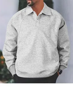 Close-up of grey polo-collar sweatshirt showing heavy fabric and ribbed cuffs
