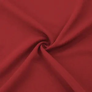 Macro view of the premium dark red fabric texture of this men's slim-fit windbreaker
