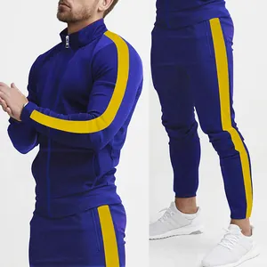 Detail of blue men's sports tracksuit with yellow side stripes and stand-up collar