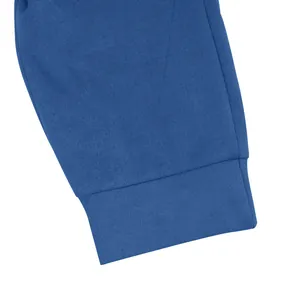 Detailed macro view of the elasticated ribbed cuff on blue suede men's tracksuit sleeve