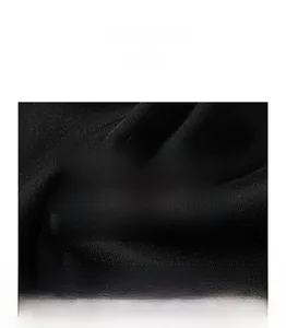 Detailed close-up of soft and breathable black knitted fabric texture for sweatshirts