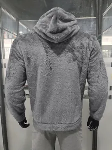 Back view of a gray plush fleece hoodie showing the soft texture and hood detail.