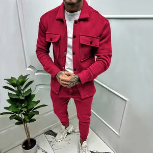 Model wearing a burgundy suede two-piece tracksuit with cargo jacket and joggers