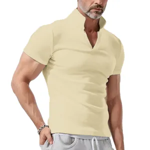 Close-up showing the fit and V-neck collar detail of the beige waffle knit polo shirt