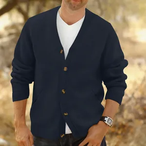 Detailed view of a navy blue men's V-neck cable knit cardigan featuring elegant button closures