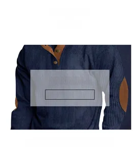 Detail of navy ribbed fabric with brown suede elbow patches on sweatshirt