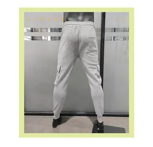 Detailed back view of grey slim fit men's cargo joggers with side pockets and cuffs