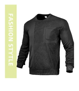 Macro detail of black men's loose knitted sweatshirt featuring corduroy patchwork design