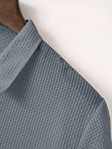 Detailed close-up showing the heavy textured gray fabric and collar of a men's polo shirt