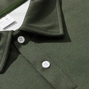Close-up of olive green men's long-sleeve polo shirt with collar and fabric texture