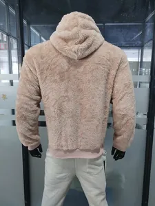 Back view of a beige fuzzy teddy fleece hooded sweatshirt displayed on a mannequin.
