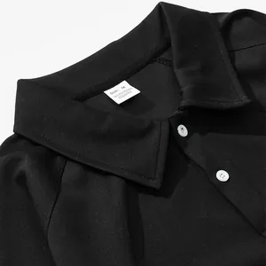 Close-up detail of a premium men's black long sleeve polo sweatshirt with white buttons