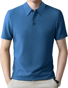 Detail view of the blue waffle textured fabric on a men's short sleeve Polo shirt.