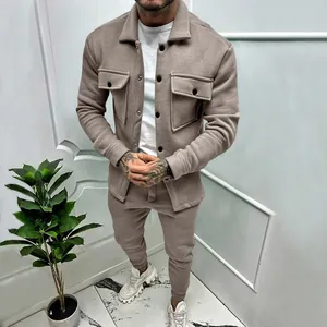 Close-up of men's taupe suede tracksuit jacket and jogger pants set for casual wear