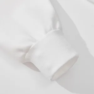 Premium white men's heavy cotton sweatshirt featuring a durable ribbed cuff detail close-up.