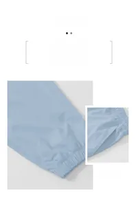 Close-up of light blue men's cargo joggers showing elastic cuffs and side pocket detail