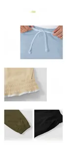 Detailed view of men's drawstring cargo pants with focus on stitching and elastic cuffs.
