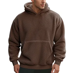 Detailed view of the brown fuzzy fleece hoodie's texture and kangaroo pocket design.