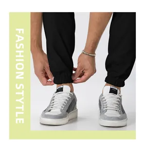 Close-up of men's black cargo joggers showing elastic cuff detail and casual fit